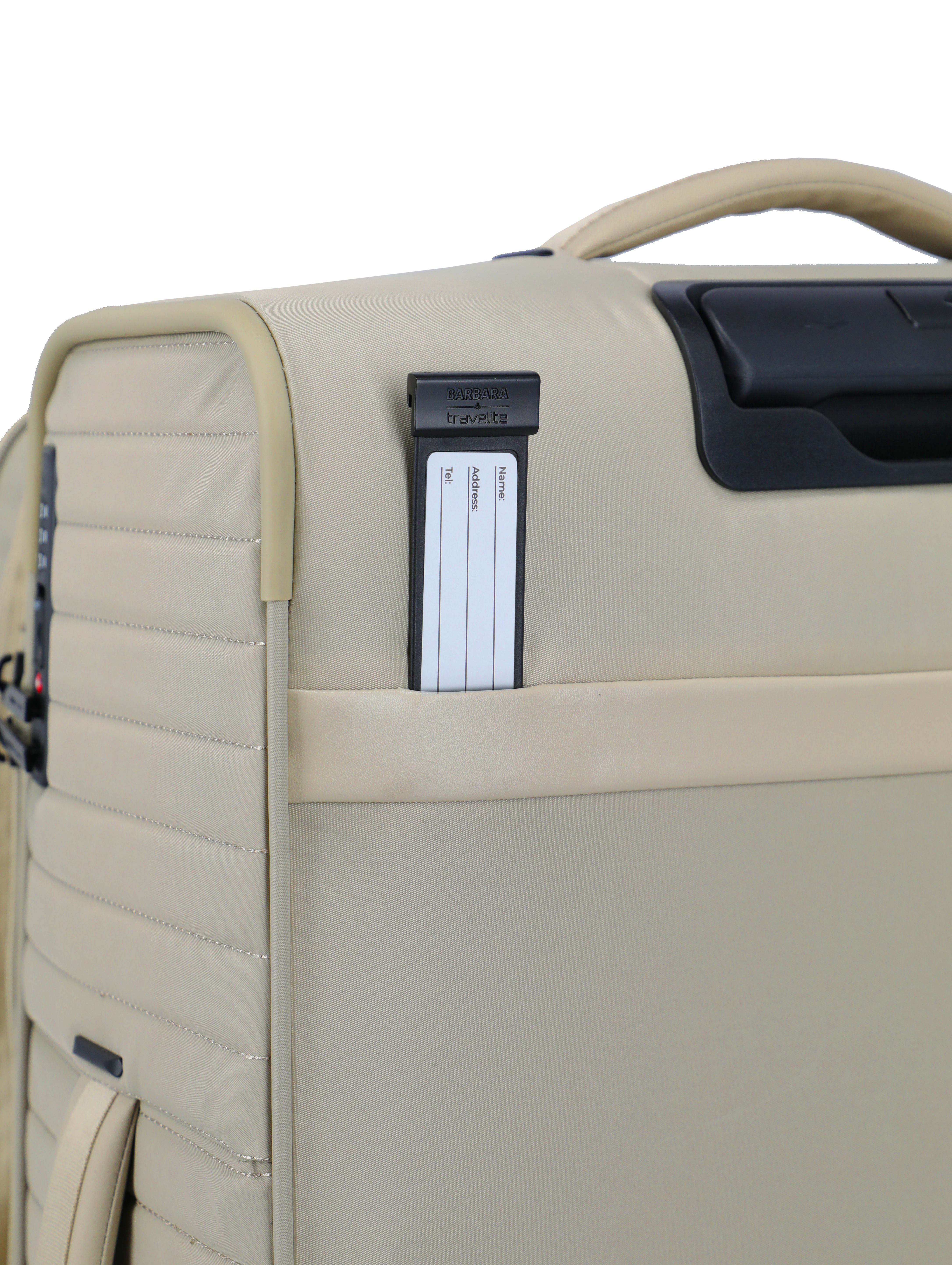 Detailansicht eines beigen Reise-Trolleys mit sichtbarem Adressschild und stabilem Handgriff