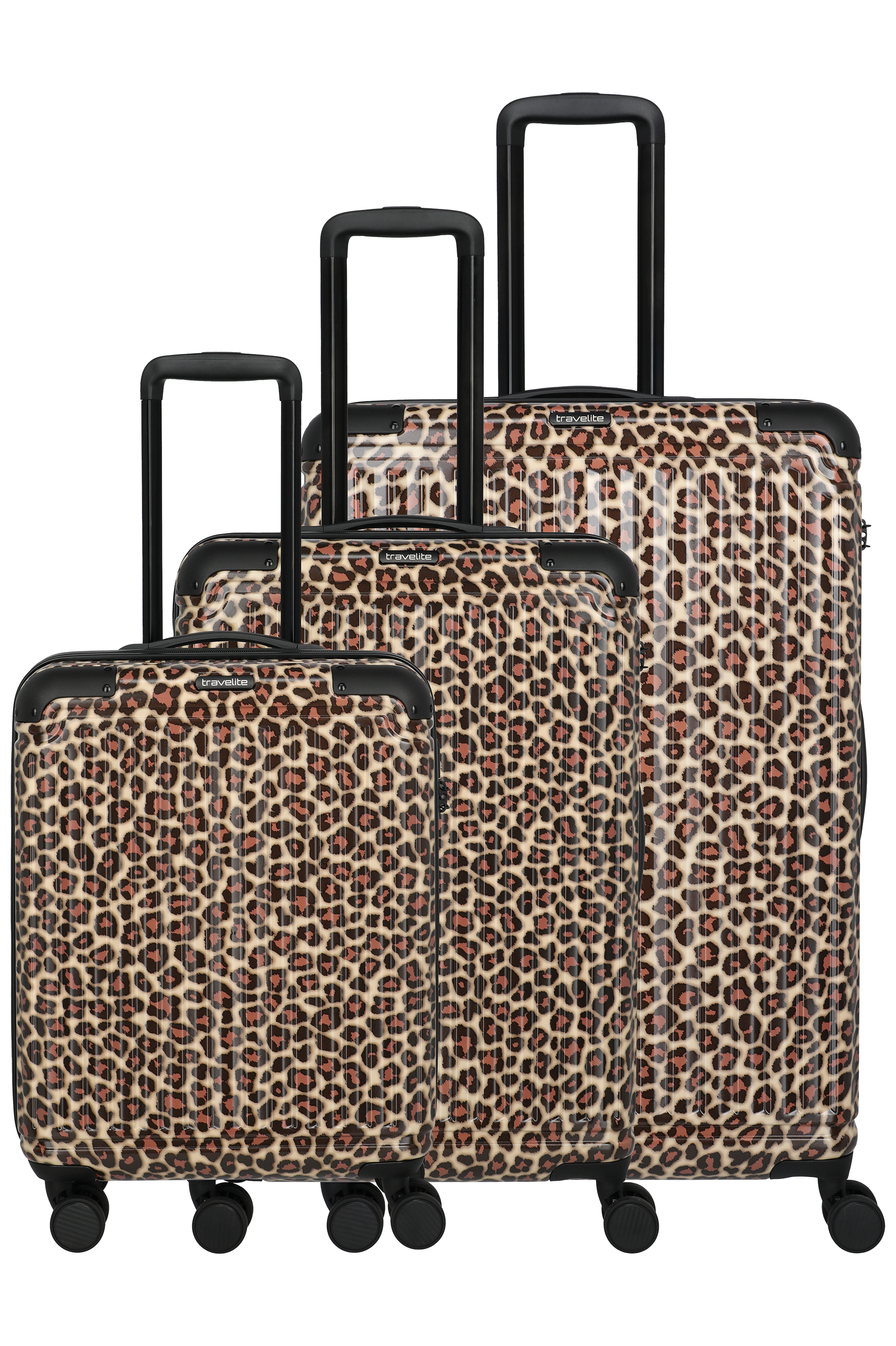 Three suitcases with black handles and wheels in ascending size, covered with brown and beige leopard spots. The pattern gives a striking look. The suitcases stand in a studio against a black background.