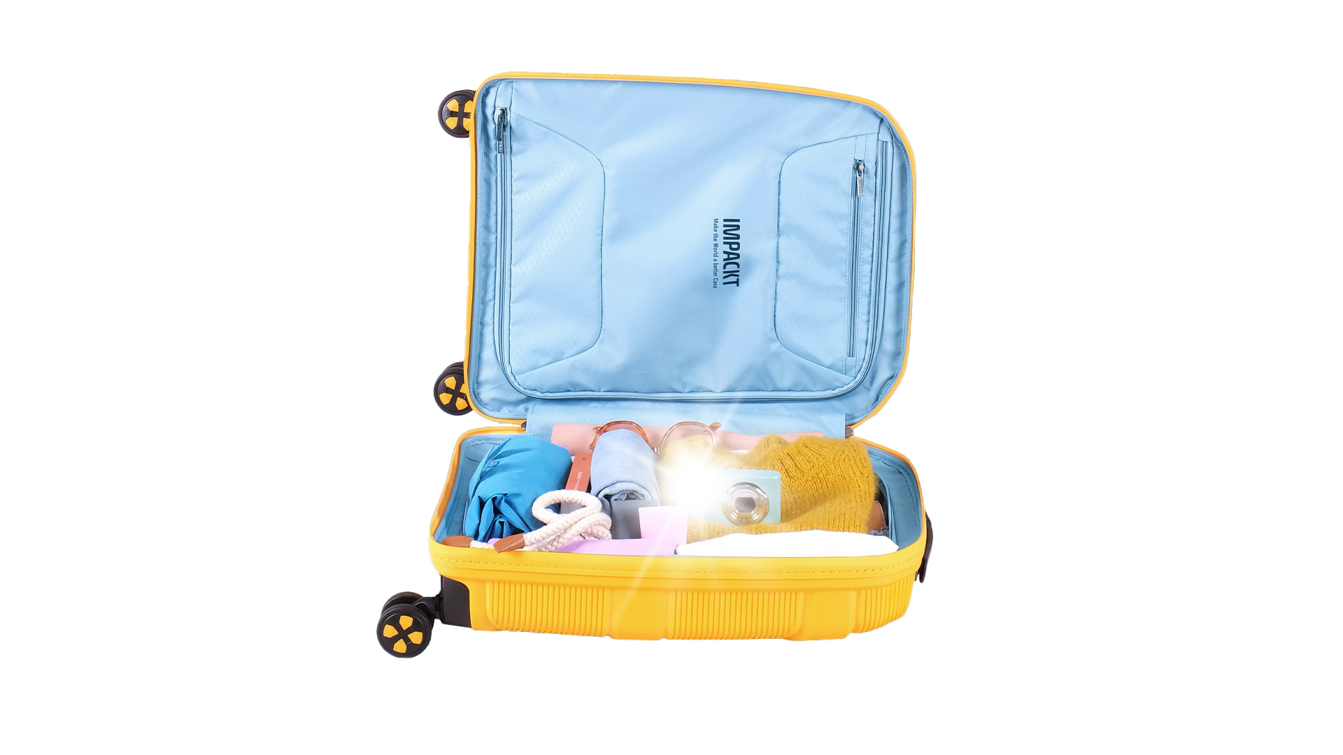 Open yellow suitcase with clothes and camera on turquoise background