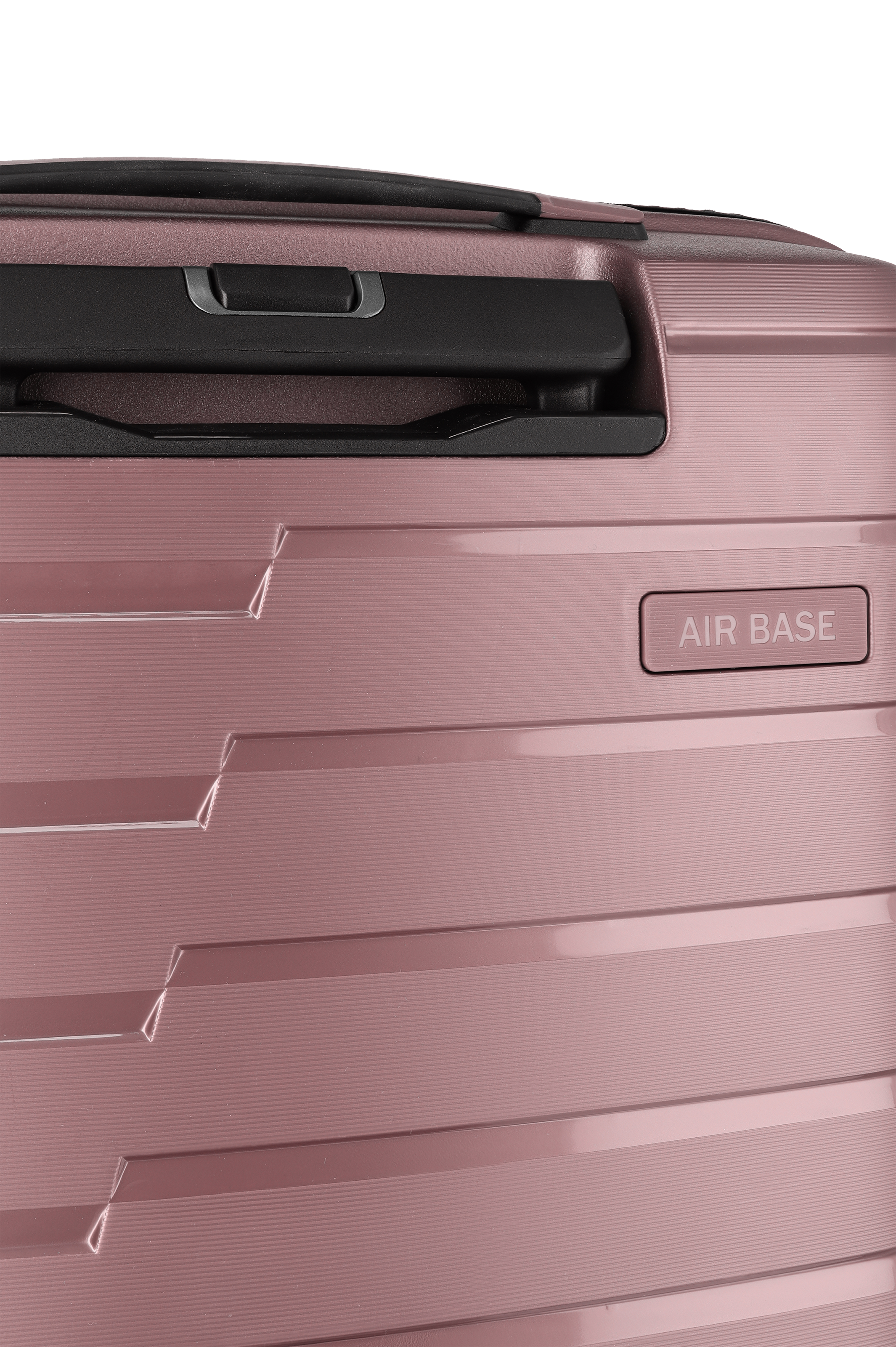 Detailansicht eines rosafarbenen Hartschalen-Trolleys mit Griff und Air Base Logo