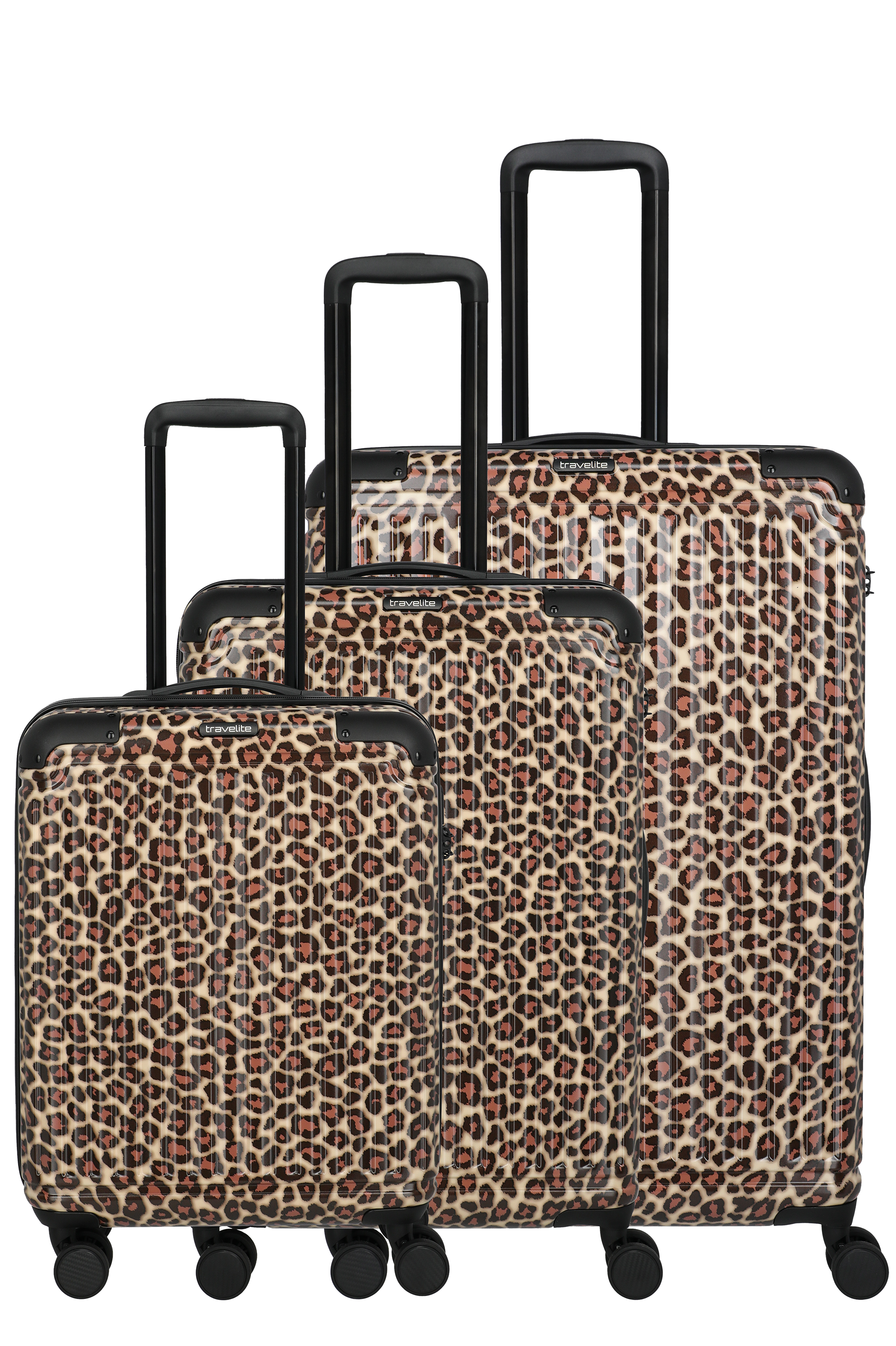 Three suitcases with black handles and wheels in ascending size, covered with brown and beige leopard spots. The pattern gives a striking look. The suitcases stand in a studio against a black background.
